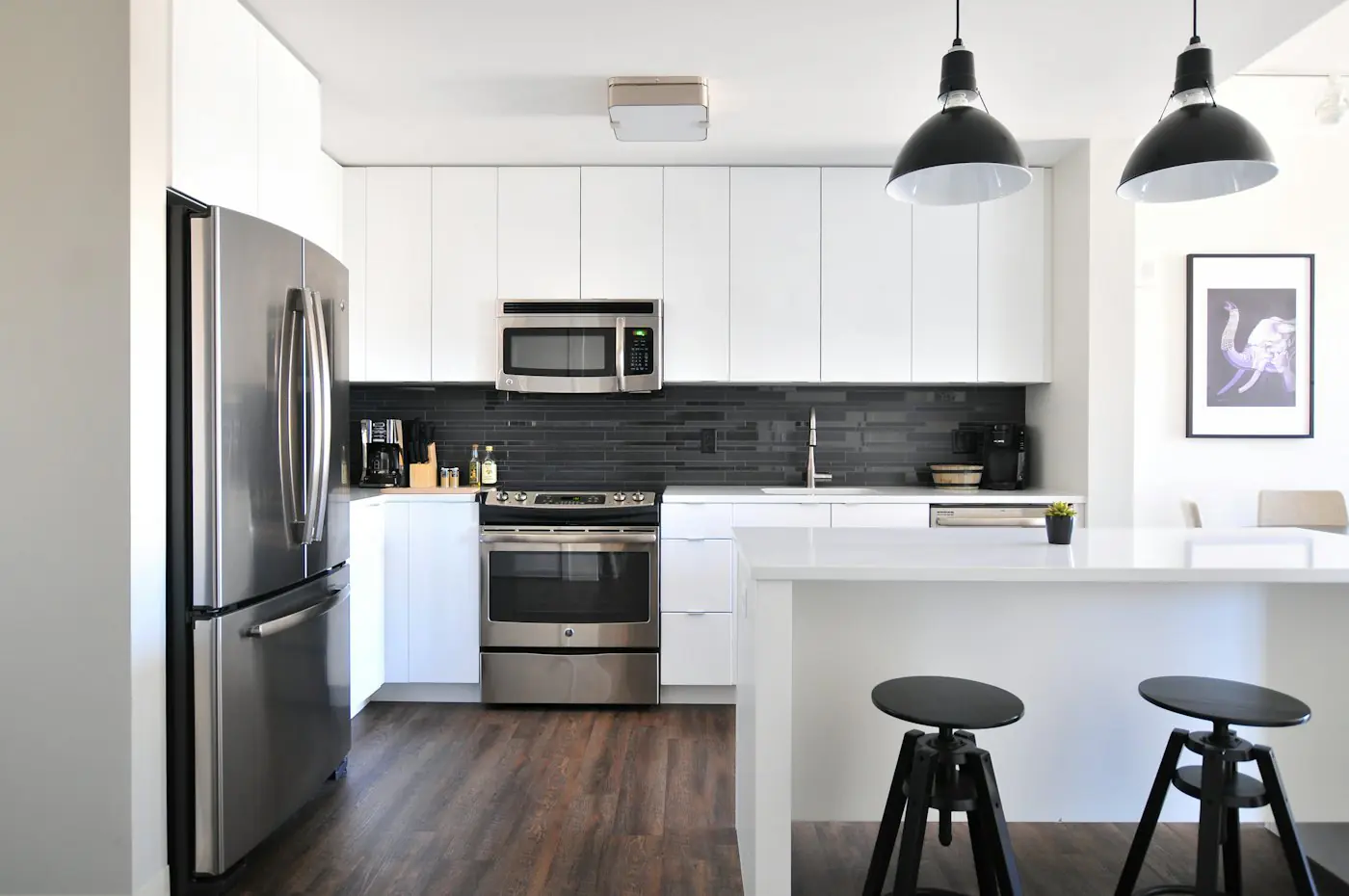 White kitchen and dining interior designed for a Hyderabad home